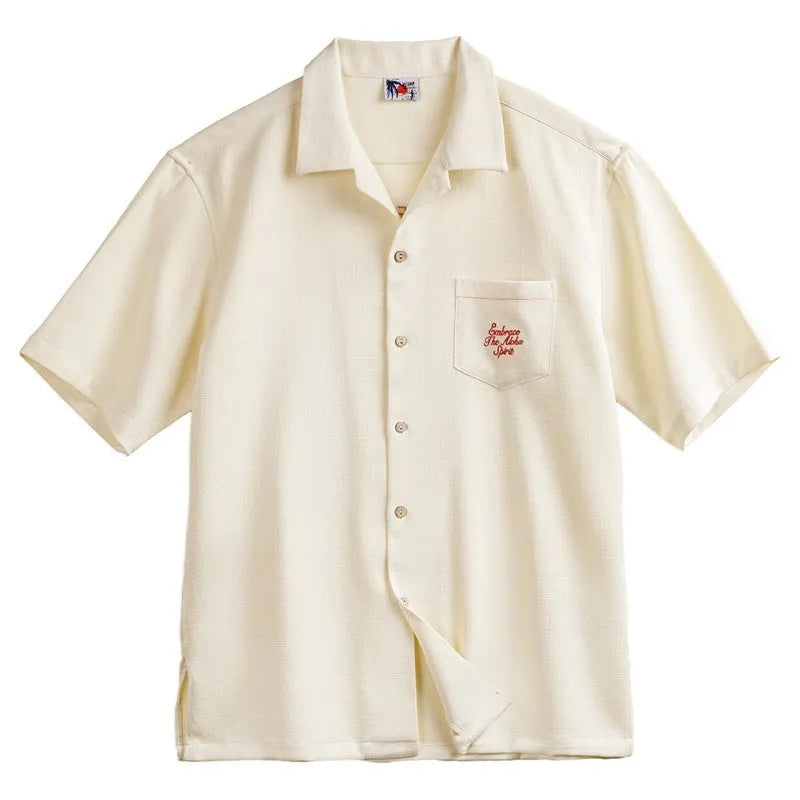 Light apricot men's shirt with bamboo and flower pattern and a Cuban collar.