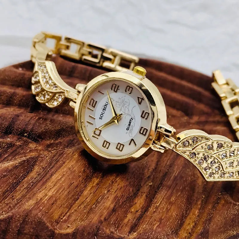 Women's stainless steel watch with round dial on wrist, showing Vachette clasp.