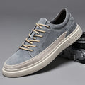 Men's grey pigskin leather casual skate shoes with flat rubber sole and lace-up front.