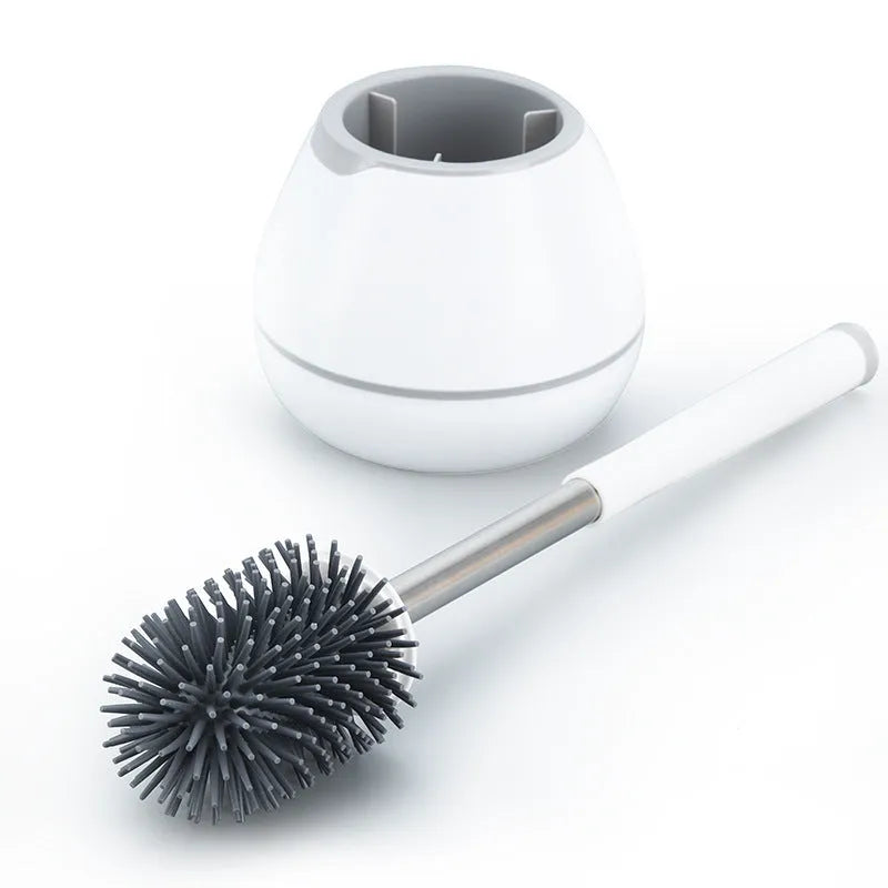 Portable toilet brush with soft silicone bristles and wall-mounted holder for bathroom cleaning