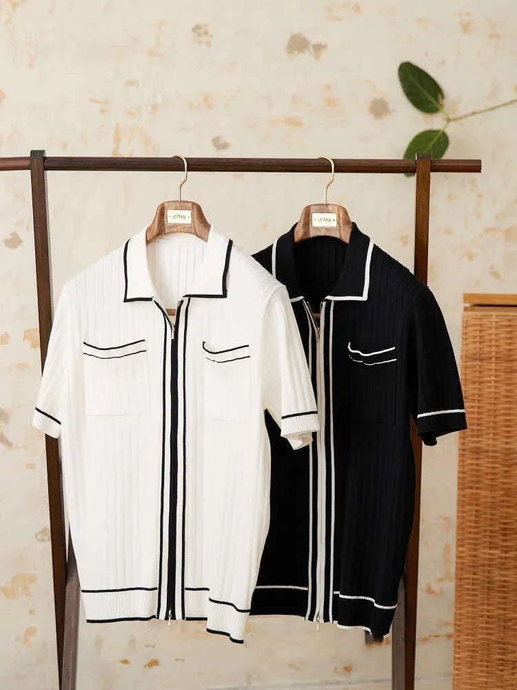 Slim black and white elastic knit polo shirt with lapel collar and short sleeves on hanger