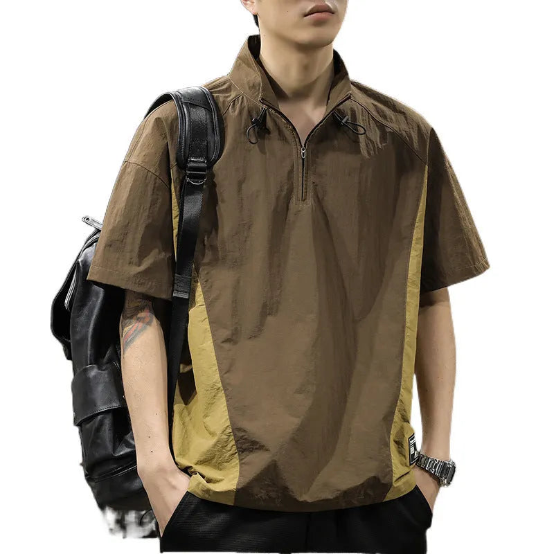 Brown men's casual half-zip short-sleeve shirt with a stand collar, showing the fleece-lined interior and loose fit.