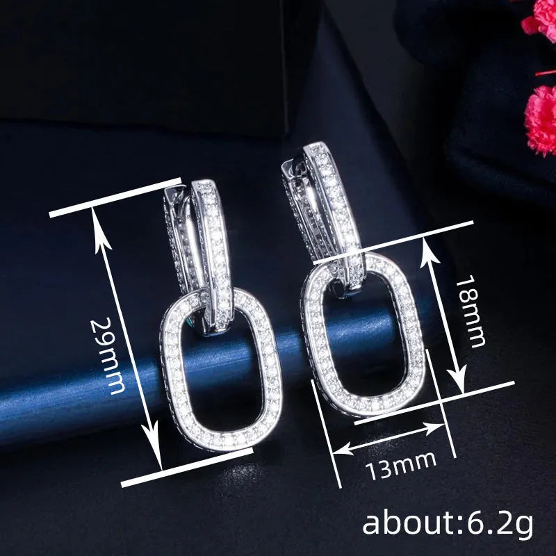 Pair of copper earrings with inlaid zircon, U-shaped geometric buckle design in white gold colour