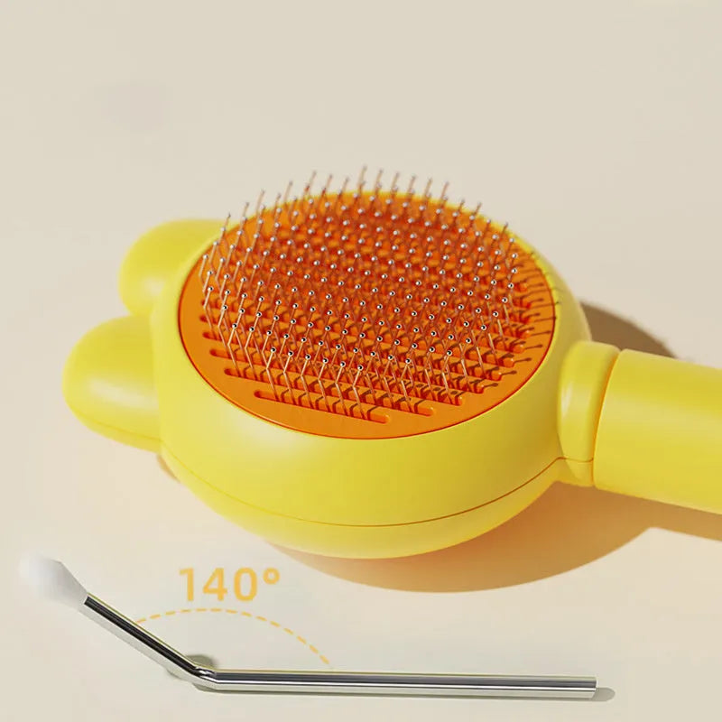 Self-cleaning pet grooming brush with green handle and stainless steel comb, showing the release button.