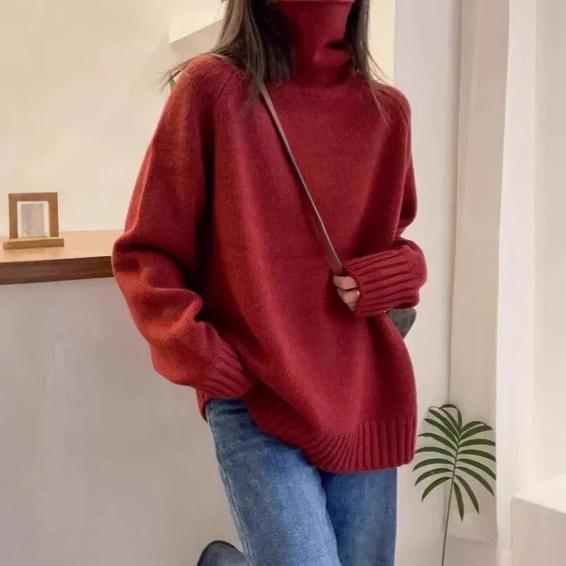 Women's loose grey turtleneck sweater with a thick, textured curling pile collar