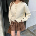 Women's solid colour cardigan with bow and pearl buttons, cashmere acrylic blend, shown in multiple colour options.