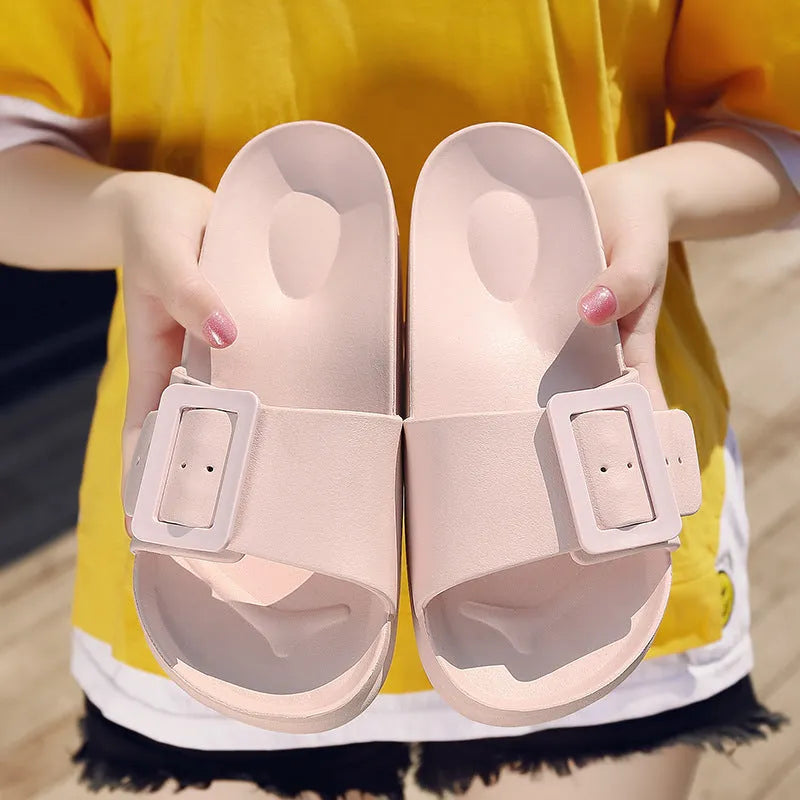 Women's grey blue EVA buckle slippers showing buckle detail and textured sole