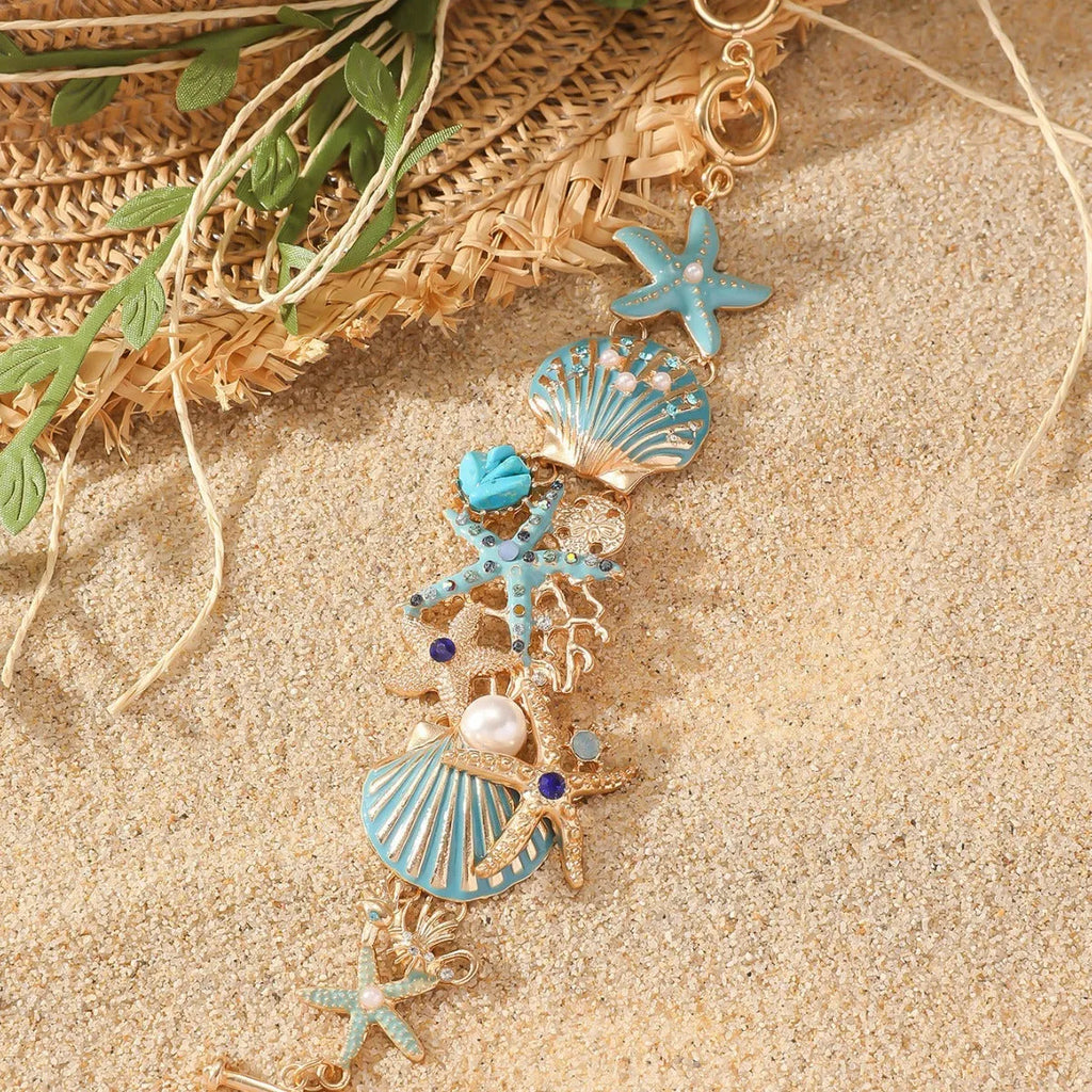 Alloy rhinestone marine bracelet with boat anchor and shell details in blue coral colour