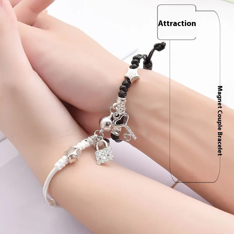 Magnetic clasp couple bracelets with alloy construction and symbolic designs including crown and love lock motifs.