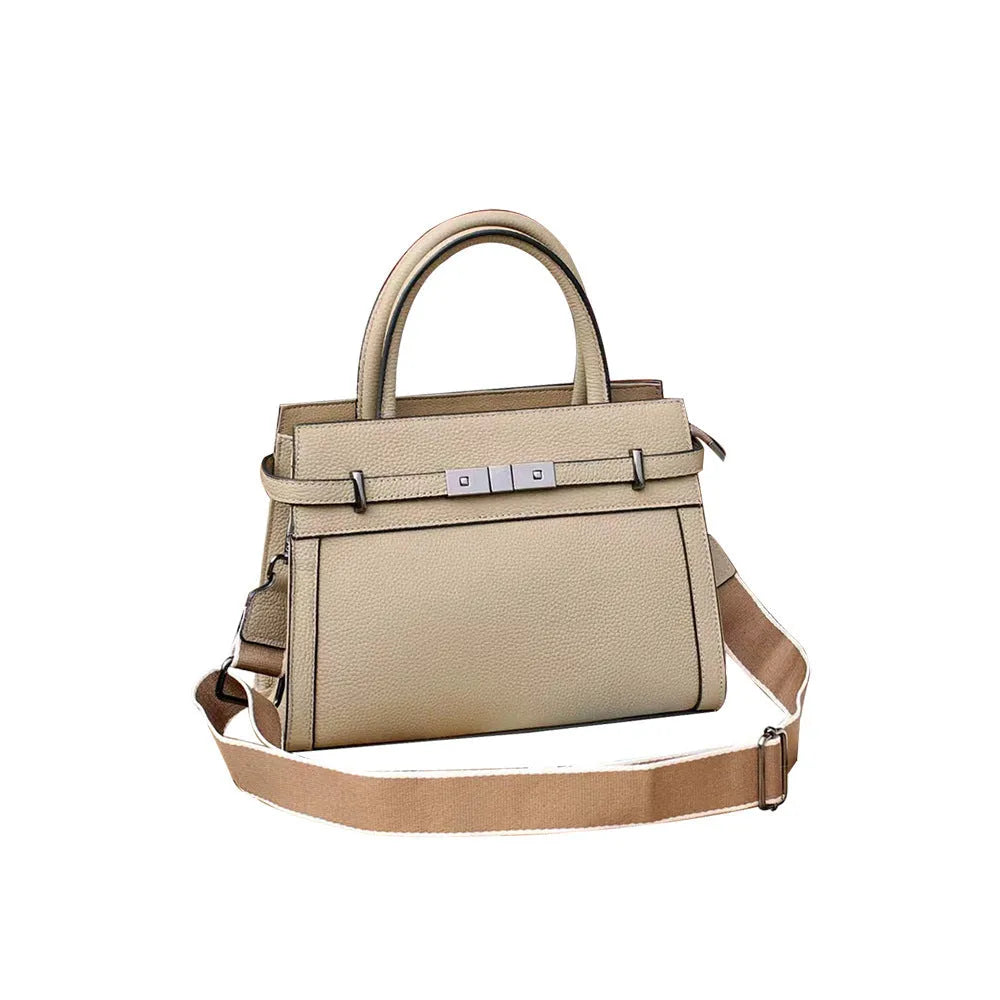 Genuine leather small square shoulder bag in almond green showing external pocket and stitching detail.