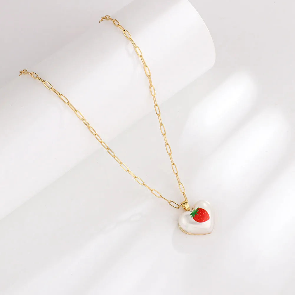Geometric fruit pendant necklace with adjustable chain showing apple, pineapple, strawberry, cherry and pear designs