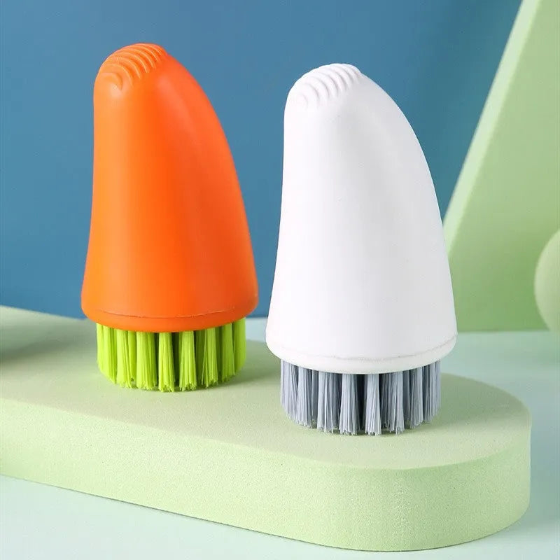 White and orange radish-shaped carrot cleaning brush with nylon bristles for washing root vegetables