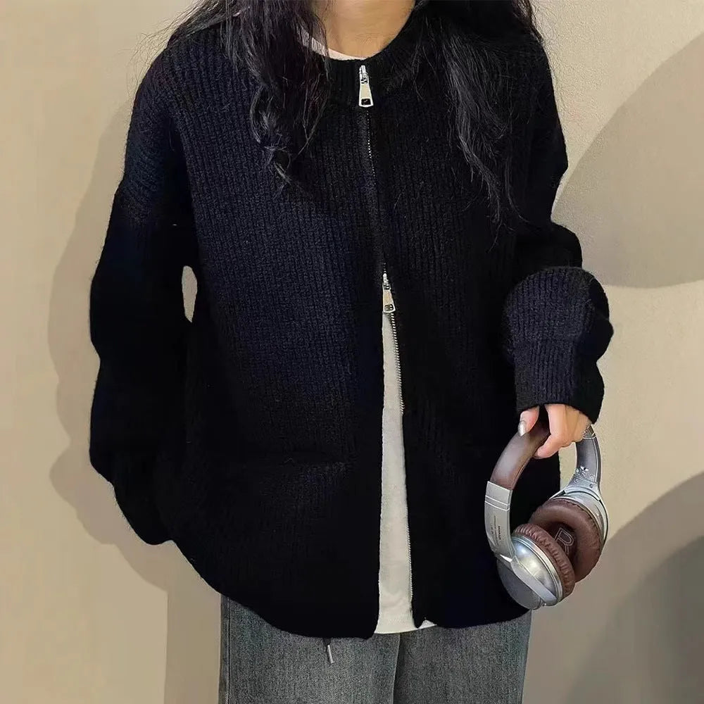 Beige women's long sleeve soft glutinous sweater coat cardigan laid flat.