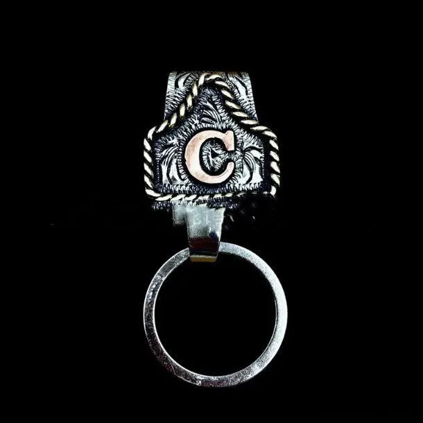 Handmade metal cow tag belt keychain in a selected colour from the A-Z letter range.