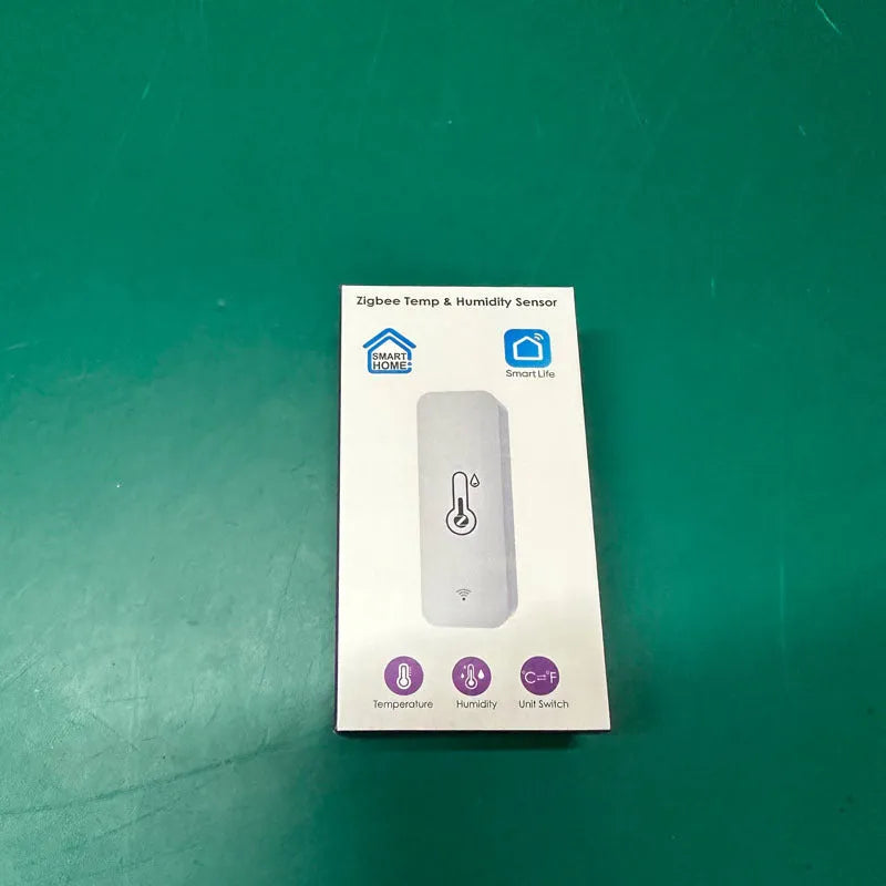 White WiFi and Zigbee temperature humidity sensor with ABS plastic housing showing measurement display