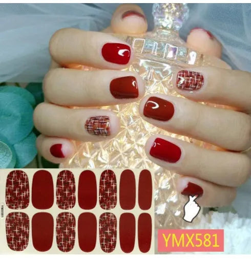 Full nail stickers set of 14 sheets showing 16 colour options in a flat lay arrangement