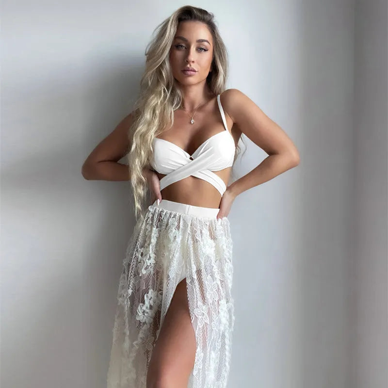 Women's creamy white three-piece bikini set with backless push up top, briefs, and skirt on a mannequin.