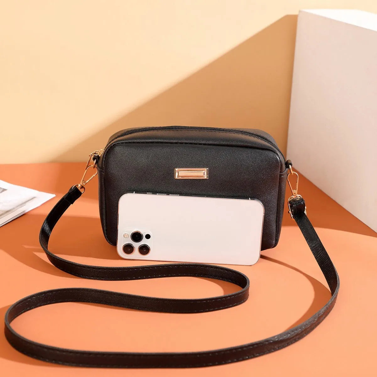 Solid colour PU women's shoulder bag showing three-dimensional pocket, in horizontal square shape.