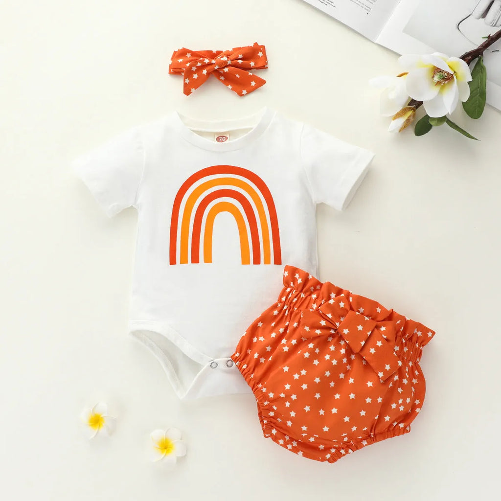 Girls' cotton rainbow romper set in beige with short sleeves and shorts, three-piece outfit on plain background