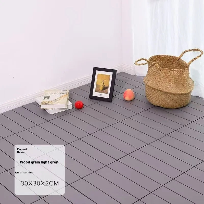 Wood grain plastic floor tiles showing splicing design and non-slip surface texture