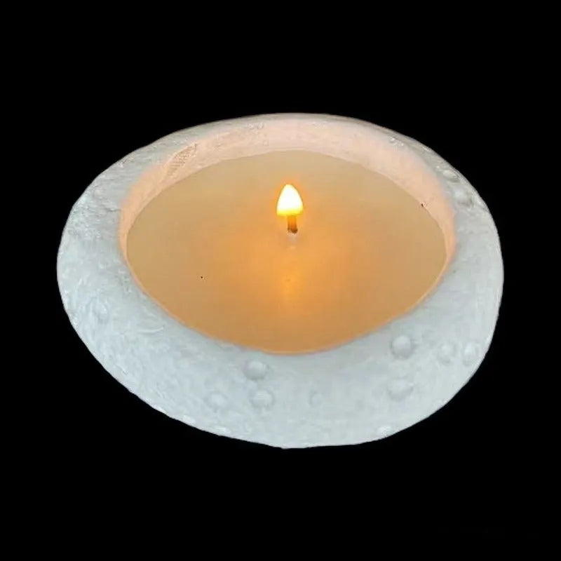 White cement fair-faced candlestick ornament for aromatherapy candles on a shelf