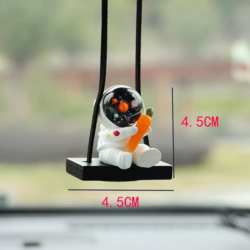 Resin cartoon astronaut car pendant decoration hanging from a rear-view mirror.