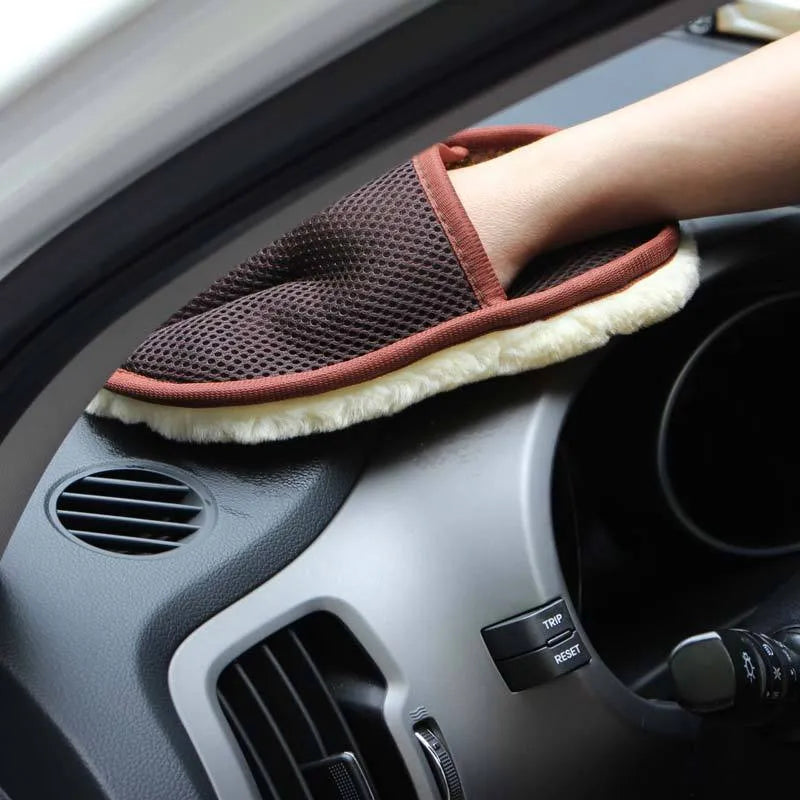 Pair of soft artificial wool car wash cleaning gloves in black, 15x24cm, on a car surface