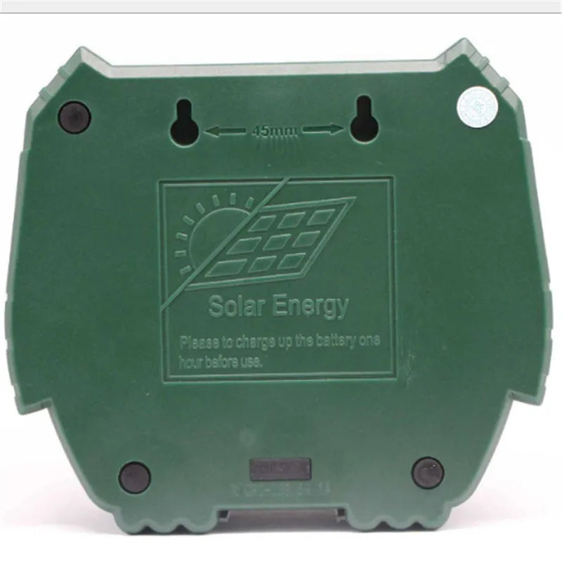 Green solar-powered ultrasonic dog repeller unit for outdoor garden protection