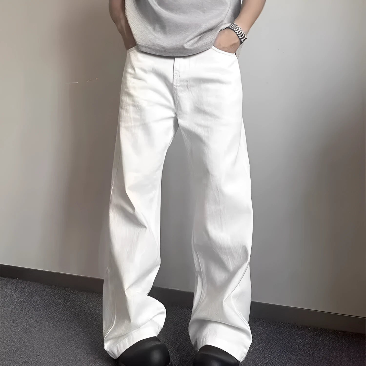 Men's white straight-leg denim jeans with a mid waist and zipper fly on a neutral background.