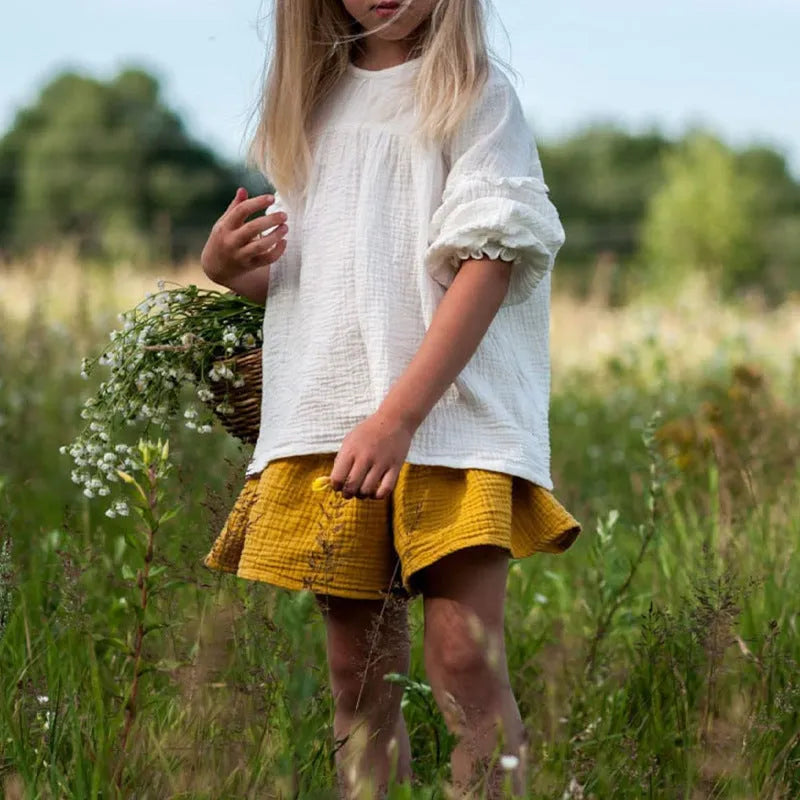 Cotton round neck doll shirt in apricot with retro chest pleating and bishop sleeves