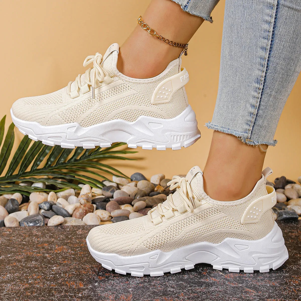 Women's low-top sports shoes with mesh upper and white sole in multiple colours.
