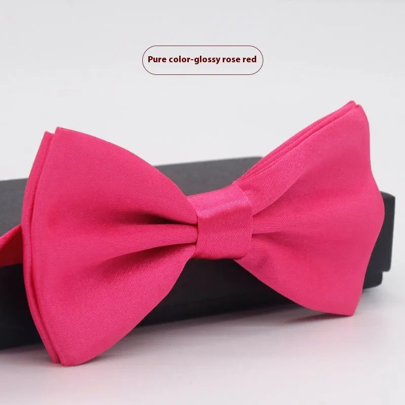 Solid colour flat head bow tie for formal wear in multiple colours including black, red, and blue.