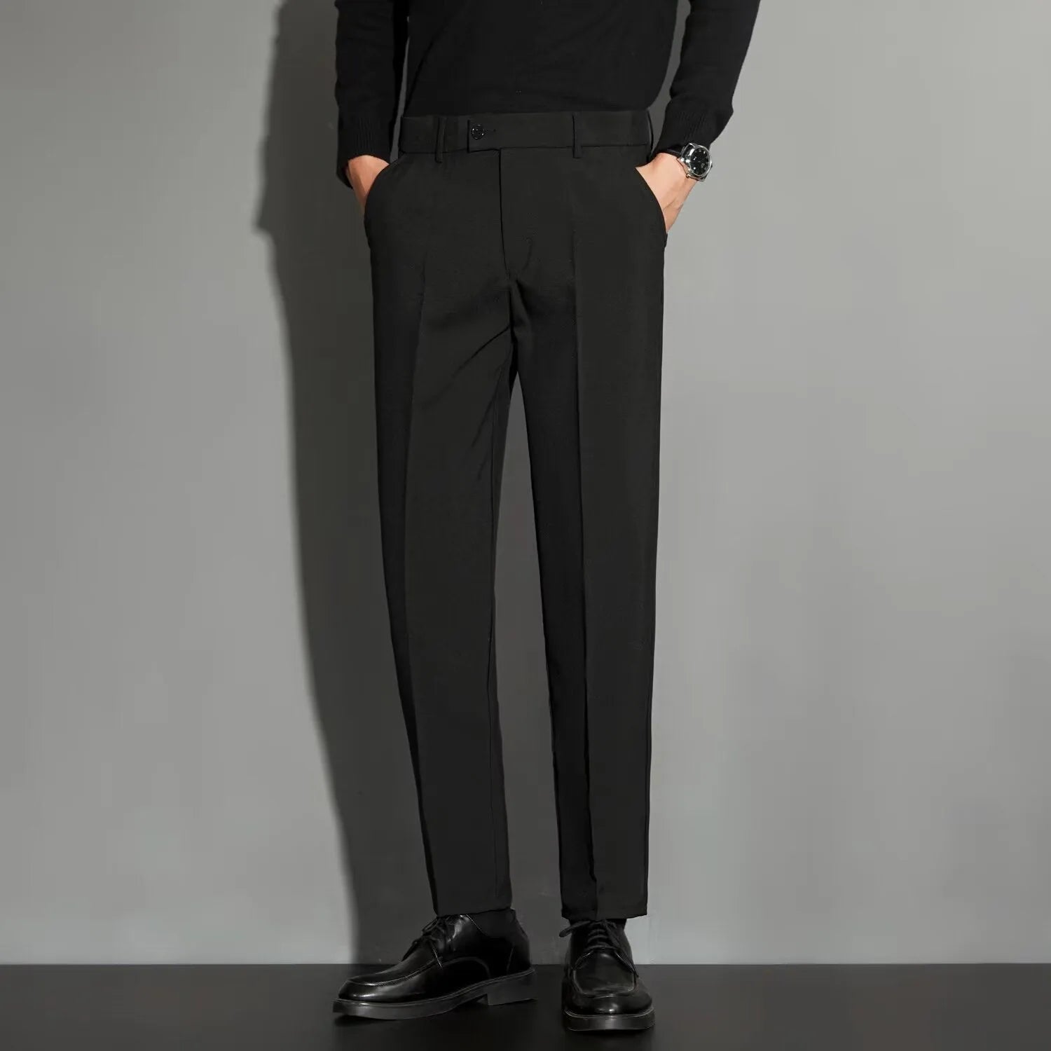 Men's straight leg ankle-length suit trousers in apricot colour on a model