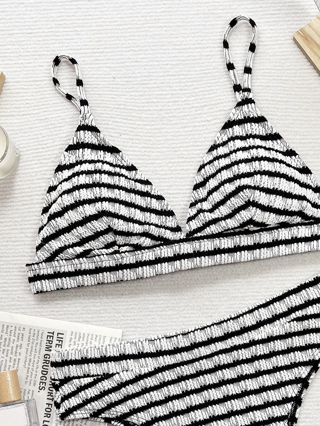 Black and white contrast women's separated bikini with brief bottom in solid colour pattern