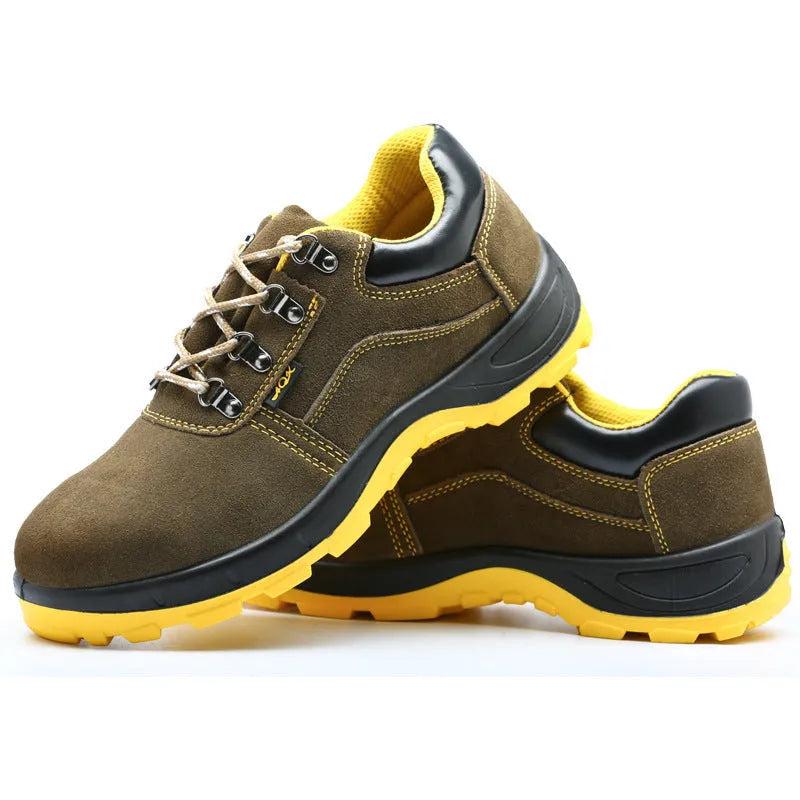 Bronze coloured leather safety boots with steel toe cap on a work site background