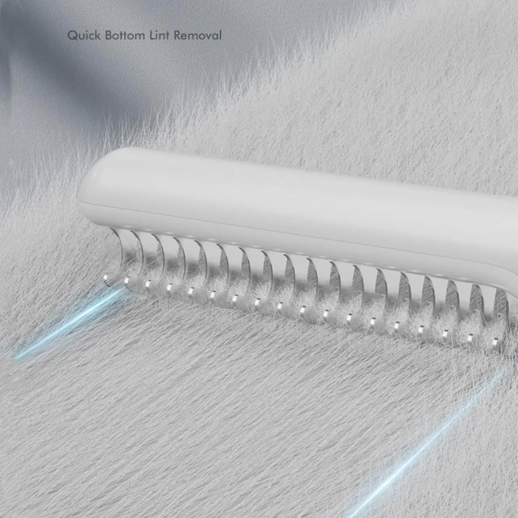 Pink and white pet dematting combs with stainless steel teeth on a wooden surface