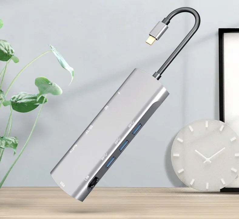 Grey aluminium USB-C docking station with HDMI, VGA, and USB 3.0 ports