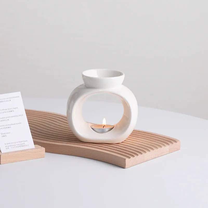 White ceramic Nordic style aromatherapy stove ornament with anti-dry burning design.