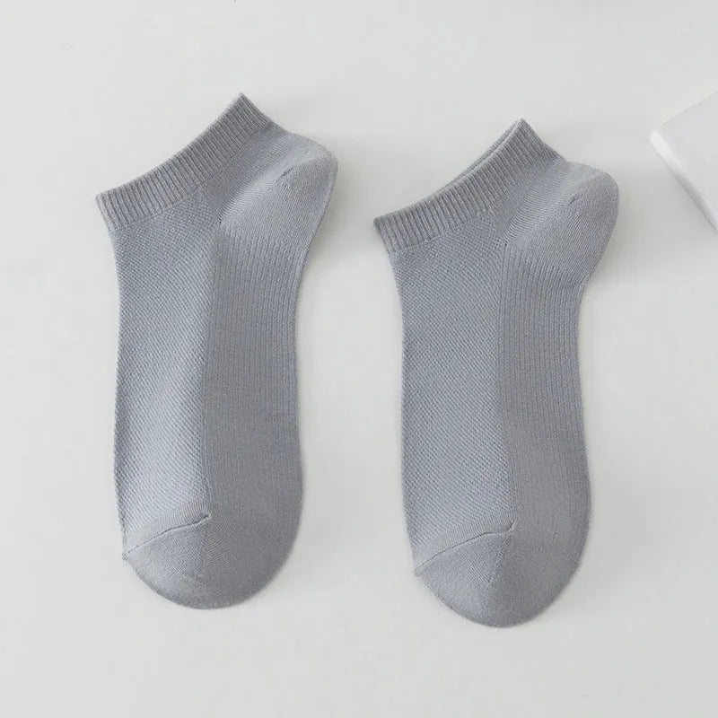 Solid colour low-cut boat socks for men made from polyester, shown in one of six available colours.