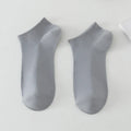 Solid colour low-cut boat socks for men made from polyester, shown in one of six available colours.