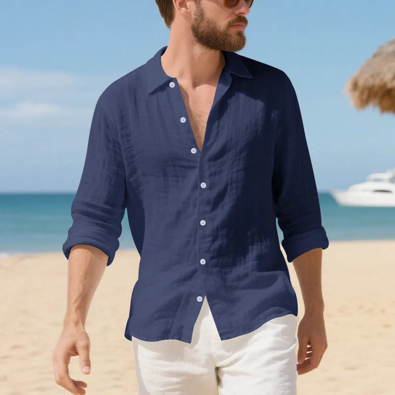 Men's loose fit linen Hawaiian casual shirt on a hanger, shown in light blue colour.