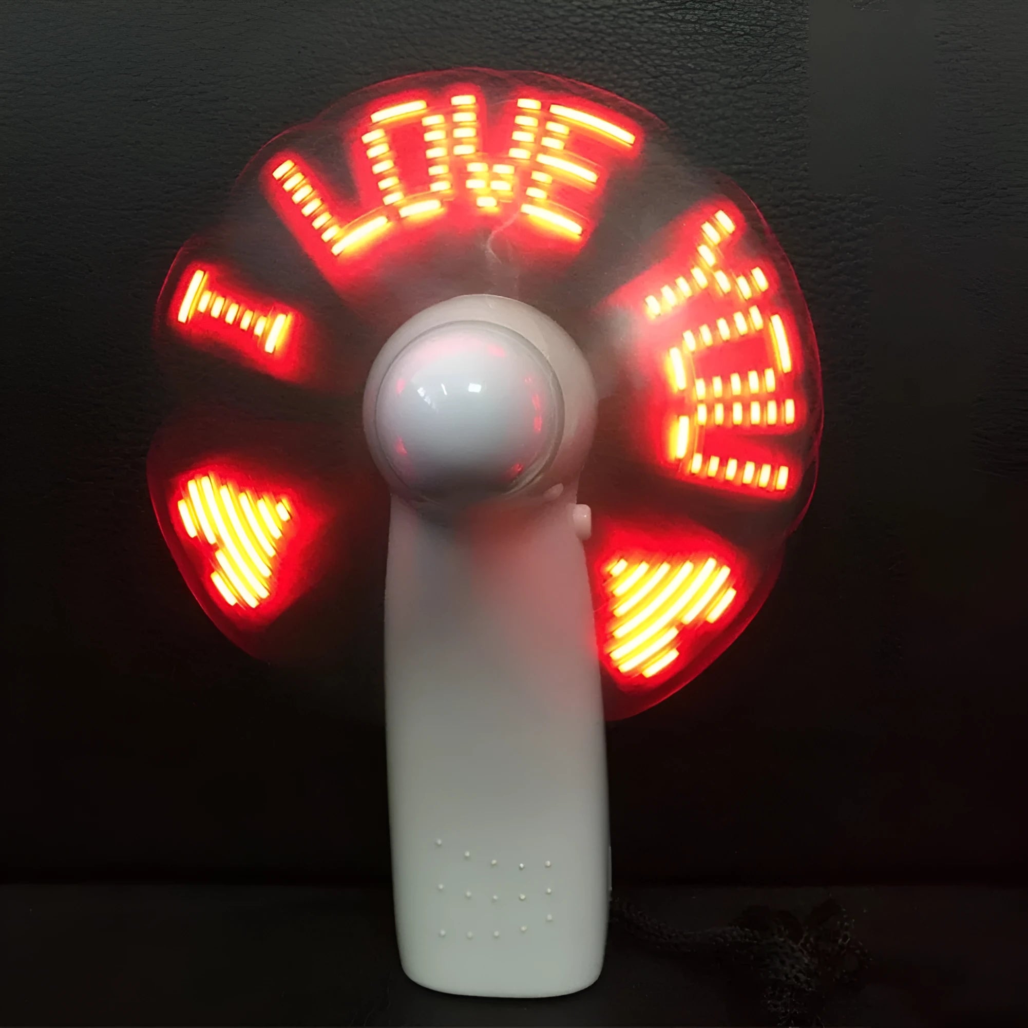 White handheld mini fan with a blue and red LED display showing 'I Love You' and a heart pattern.