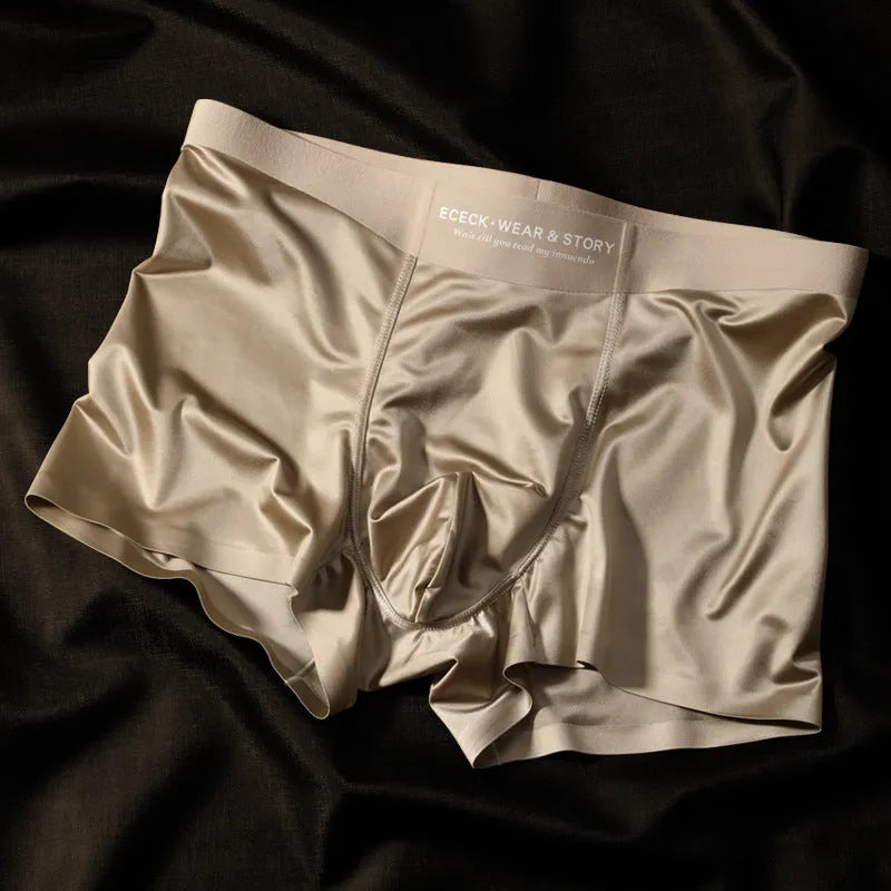 Men's solid colour ice silk seamless underwear laid flat, showing its knit construction.