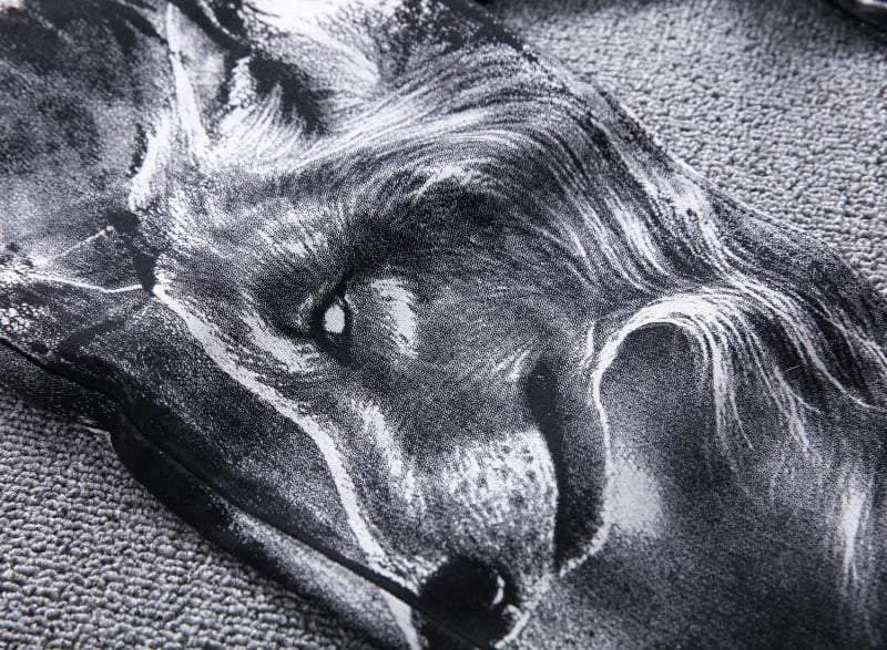 Men's black wolf print jeans with realistic wolf head design on cotton denim fabric