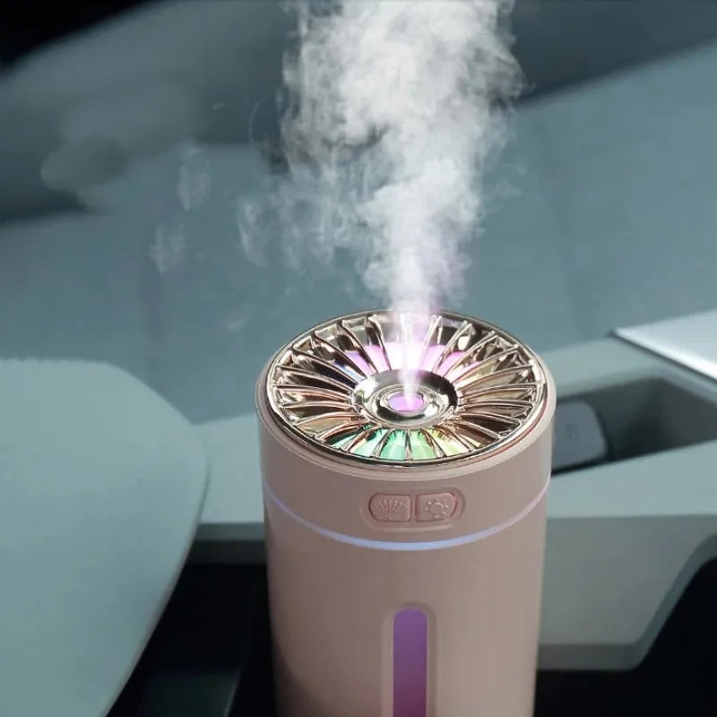 Black and white portable USB rechargeable humidifier with colourful lights for car and desktop use.