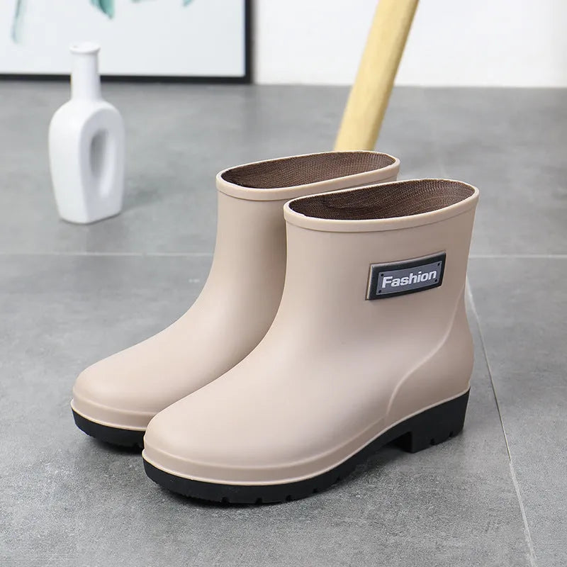 Women's mid-calf PVC rain boots in black with low heel design
