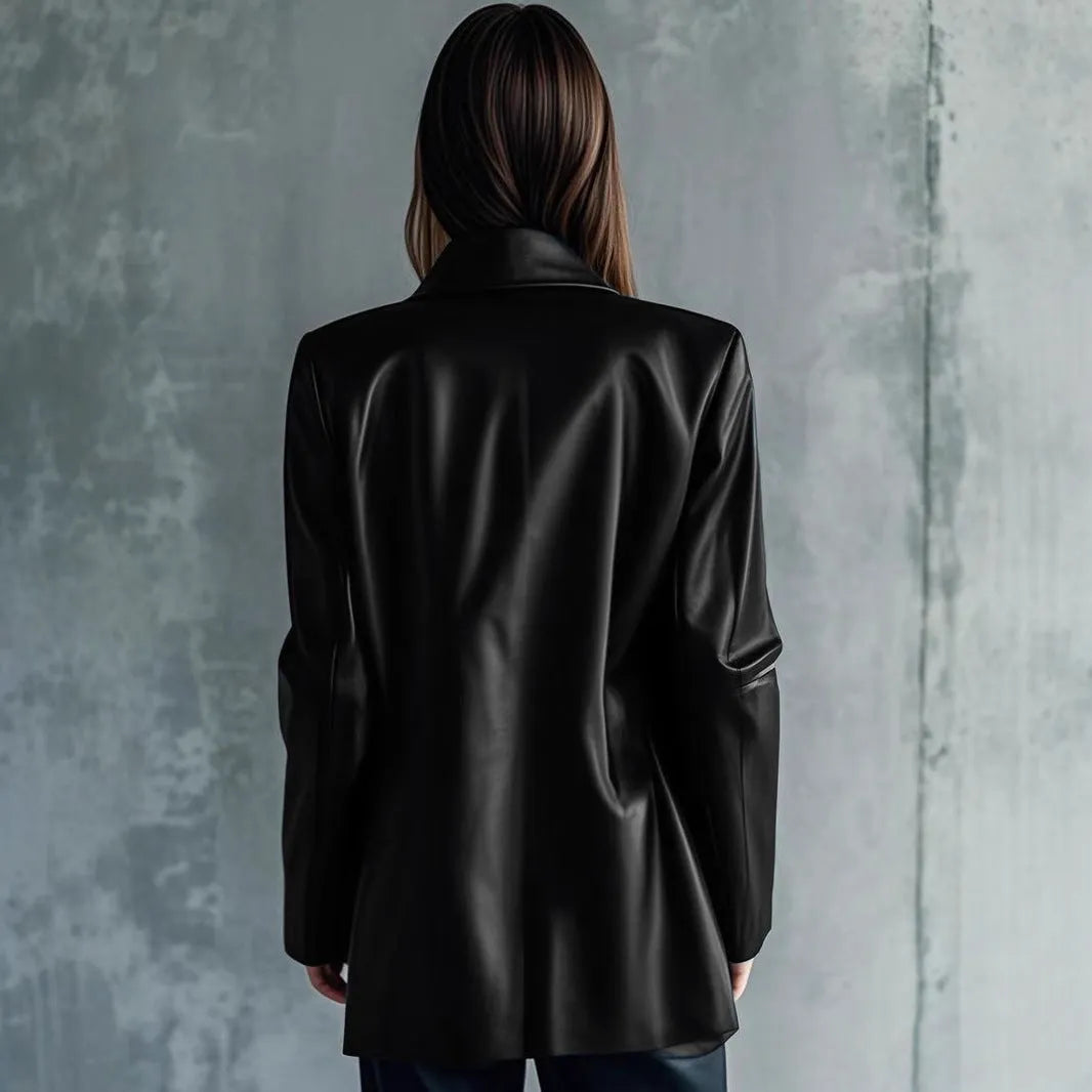 Women's black medium-length leather jacket with long sleeves on hanger