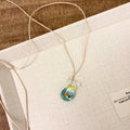 Women's necklace with coloured glaze joker skirt pendant on a cotton linen clavicle chain