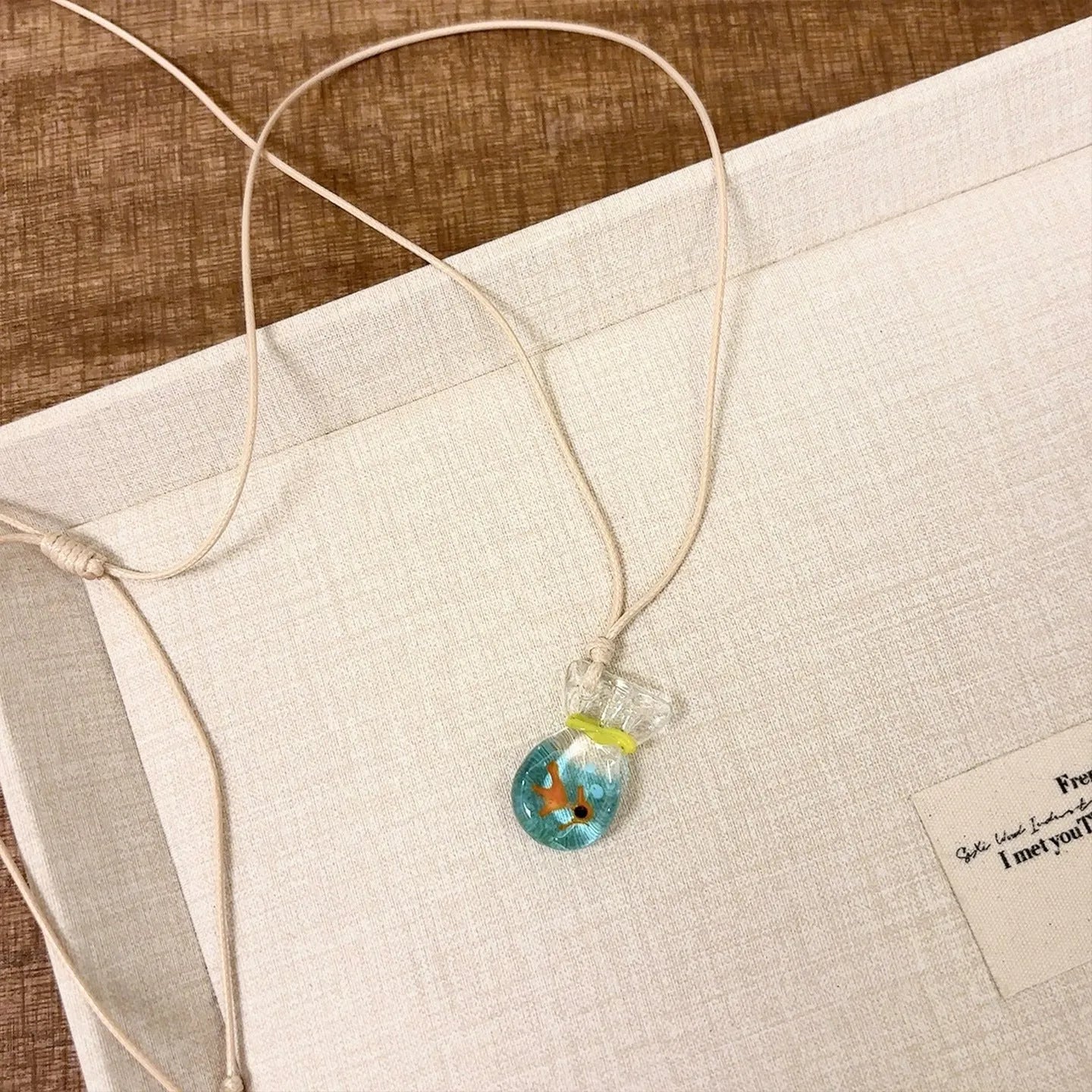 Women's necklace with coloured glaze joker skirt pendant on a cotton linen clavicle chain