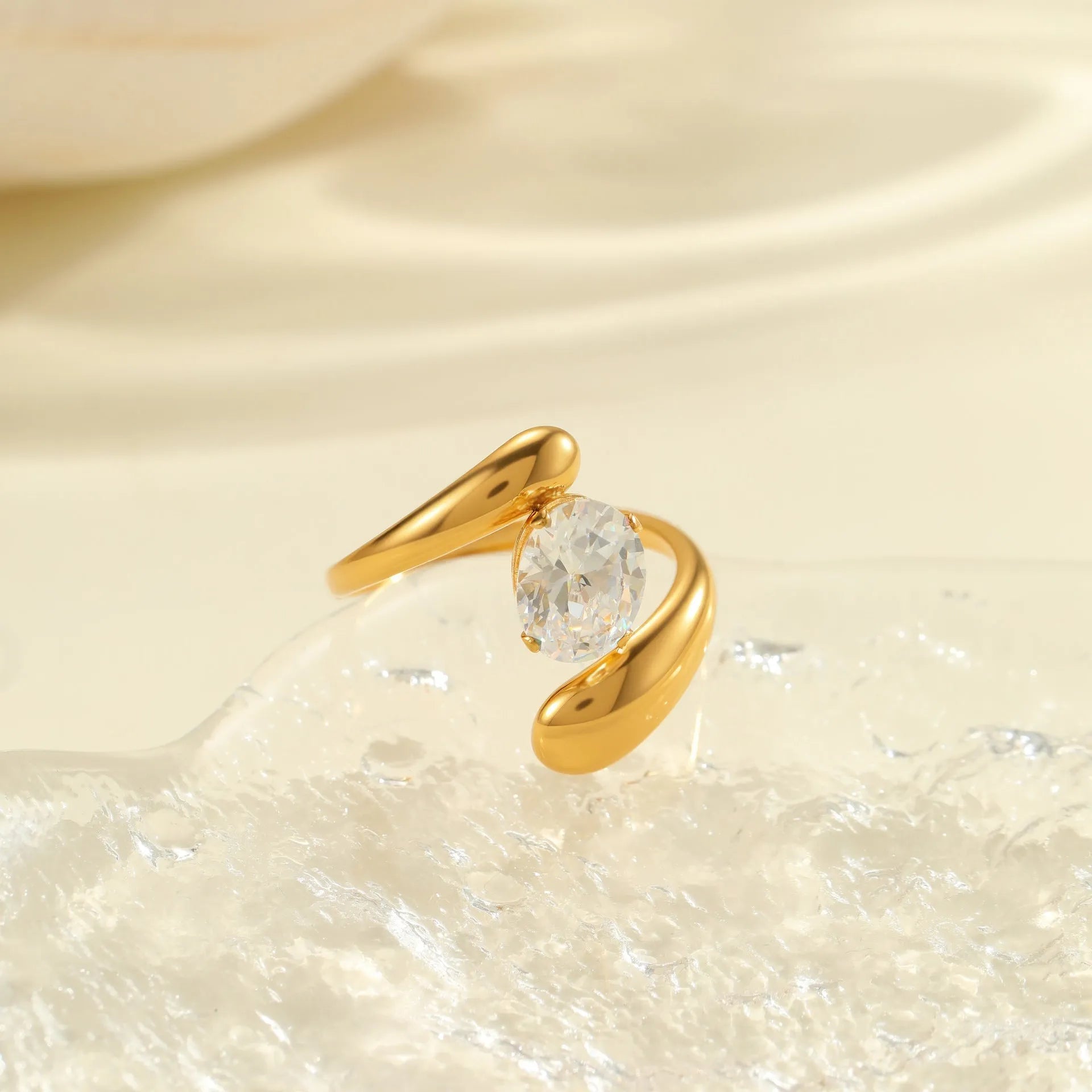 Adjustable geometric stainless steel ring showing open mouth design and colour variations